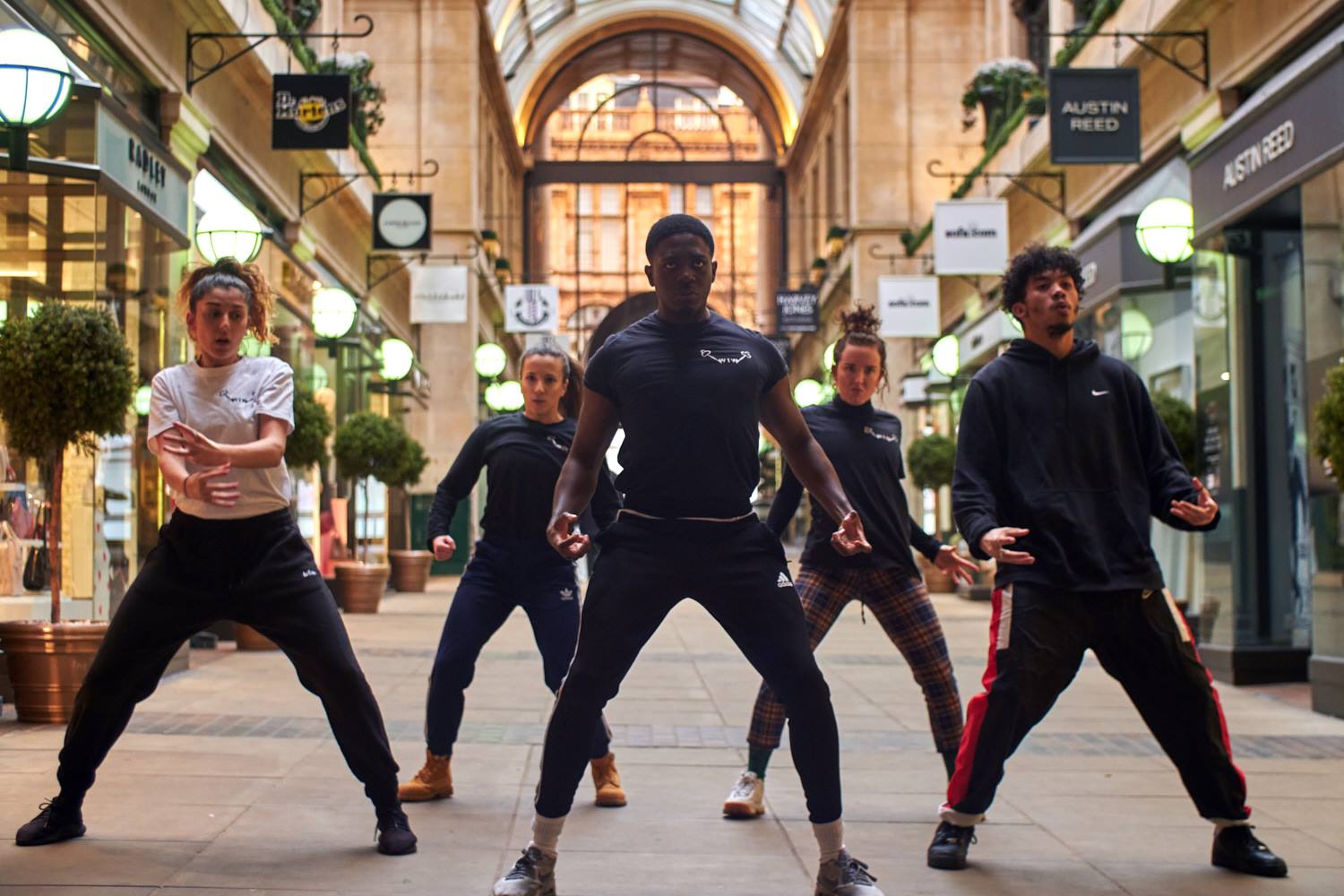 A troupe of young dancers in a shopping mall in Nottingham perform a contemporary dance routine